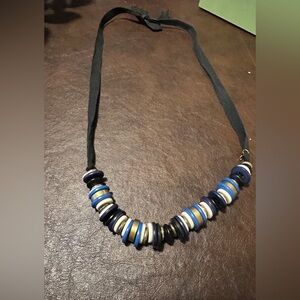 Loft black necklace with blue, white, gold, and black beads